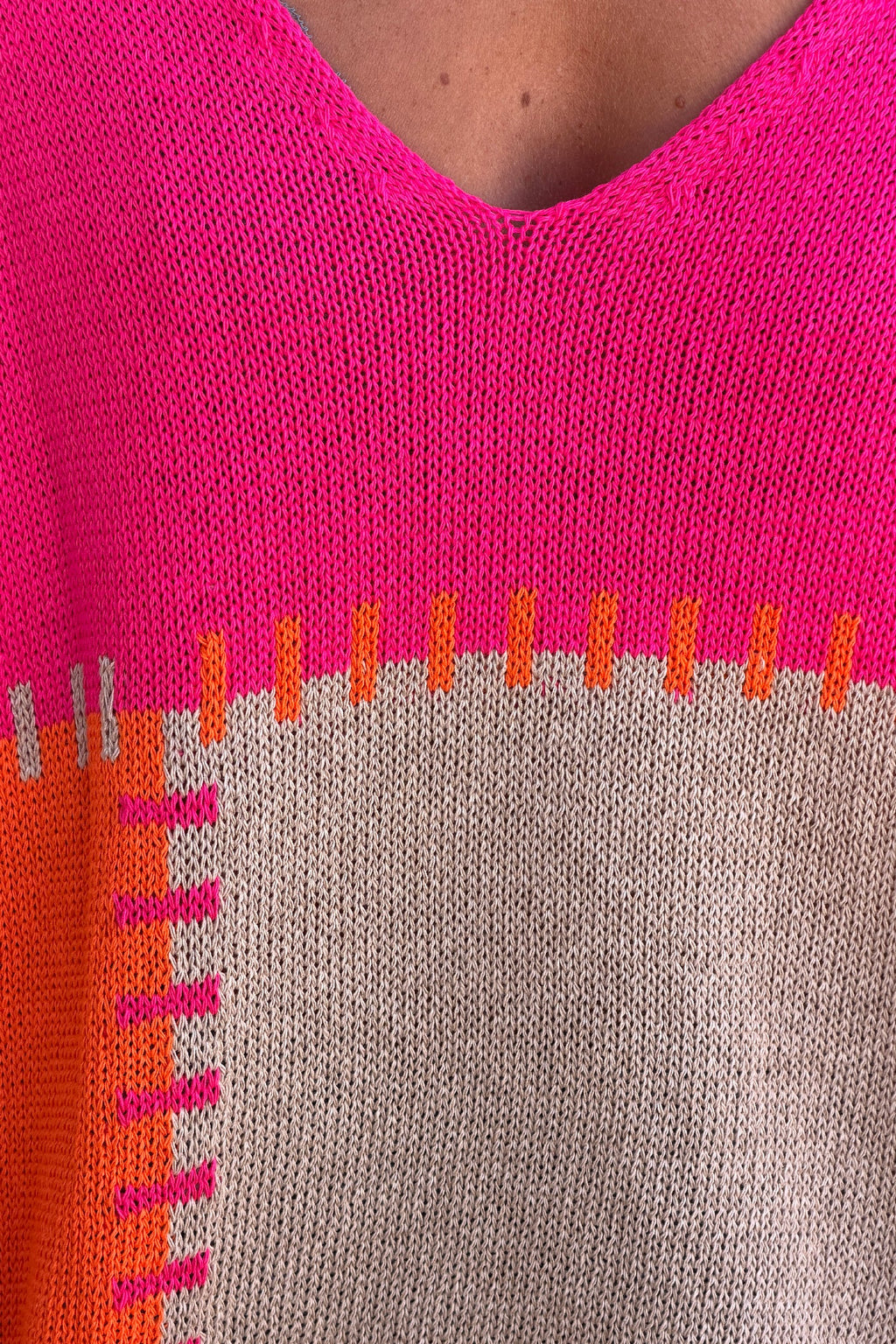 Lidia - Suéter holgado de punto de algodón con diseño de patchwork en naranja y fucsia