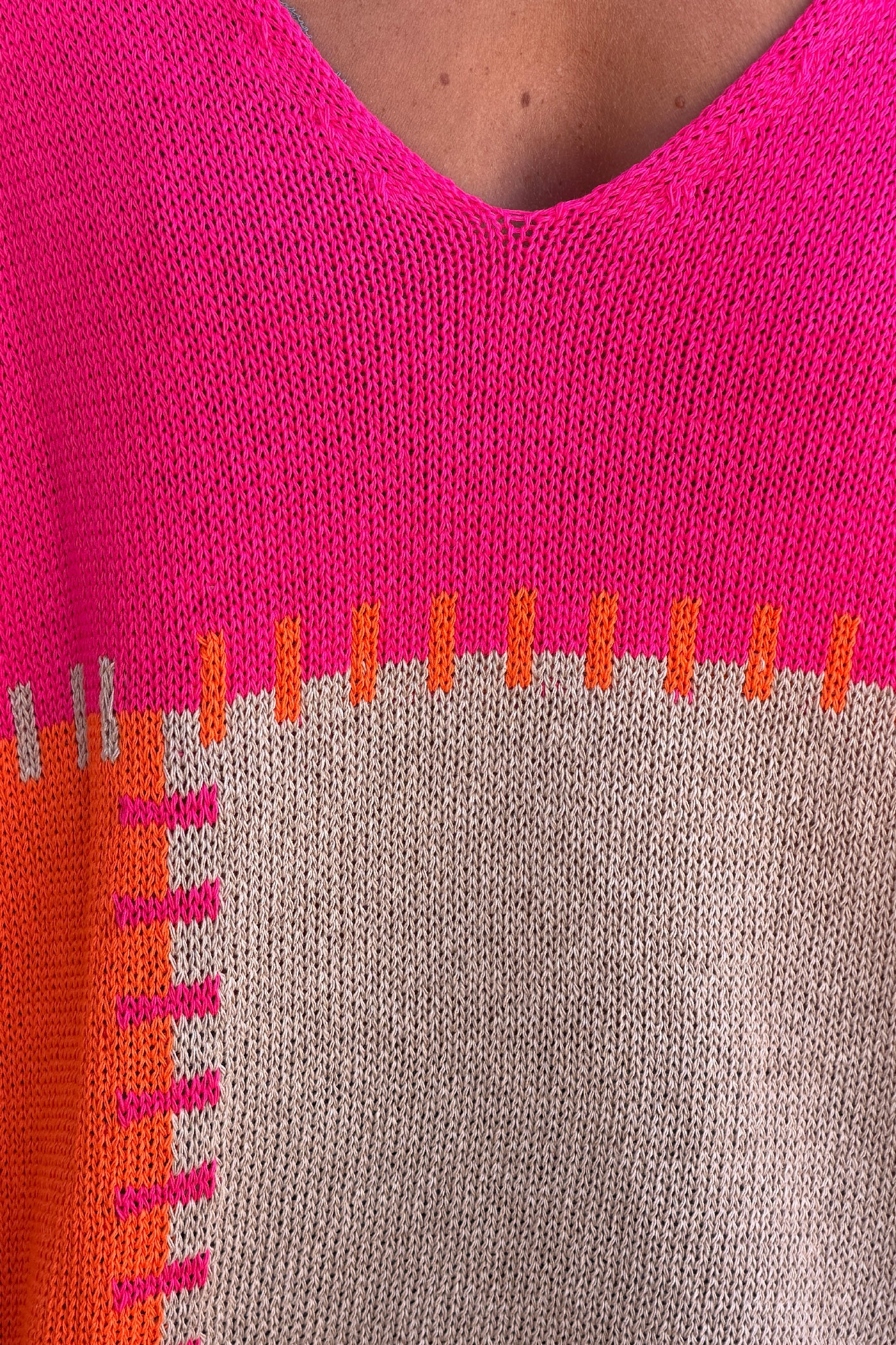 Lidia - Suéter holgado de punto de algodón con diseño de patchwork en naranja y fucsia