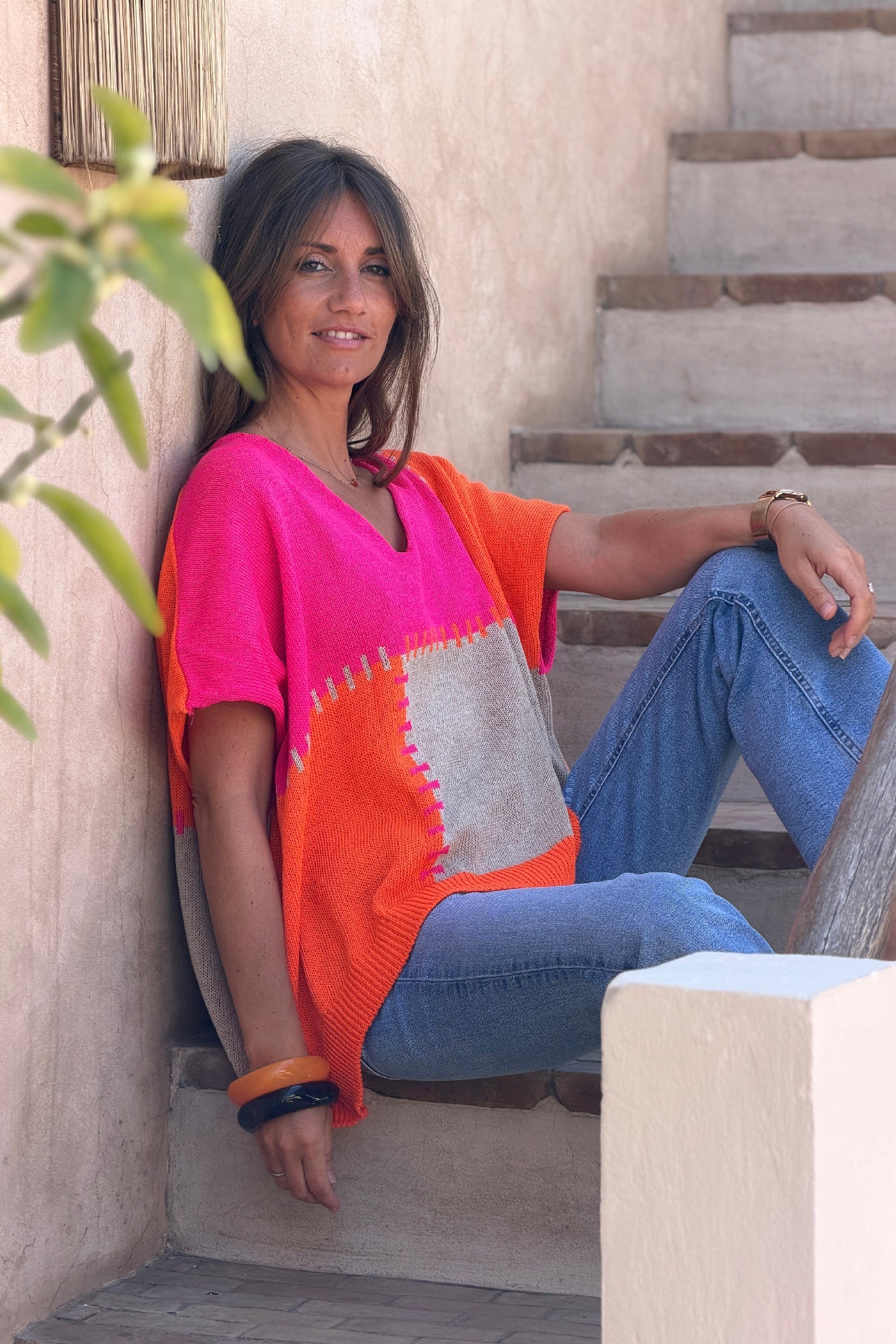 Lidia - Suéter holgado de punto de algodón con diseño de patchwork en naranja y fucsia