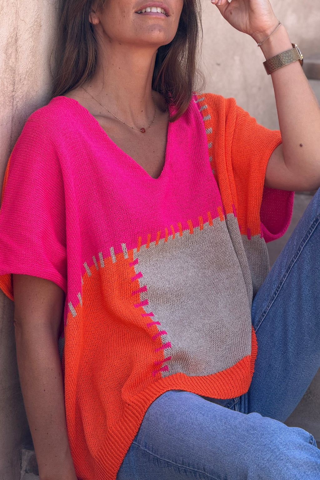 Lidia - Suéter holgado de punto de algodón con diseño de patchwork en naranja y fucsia