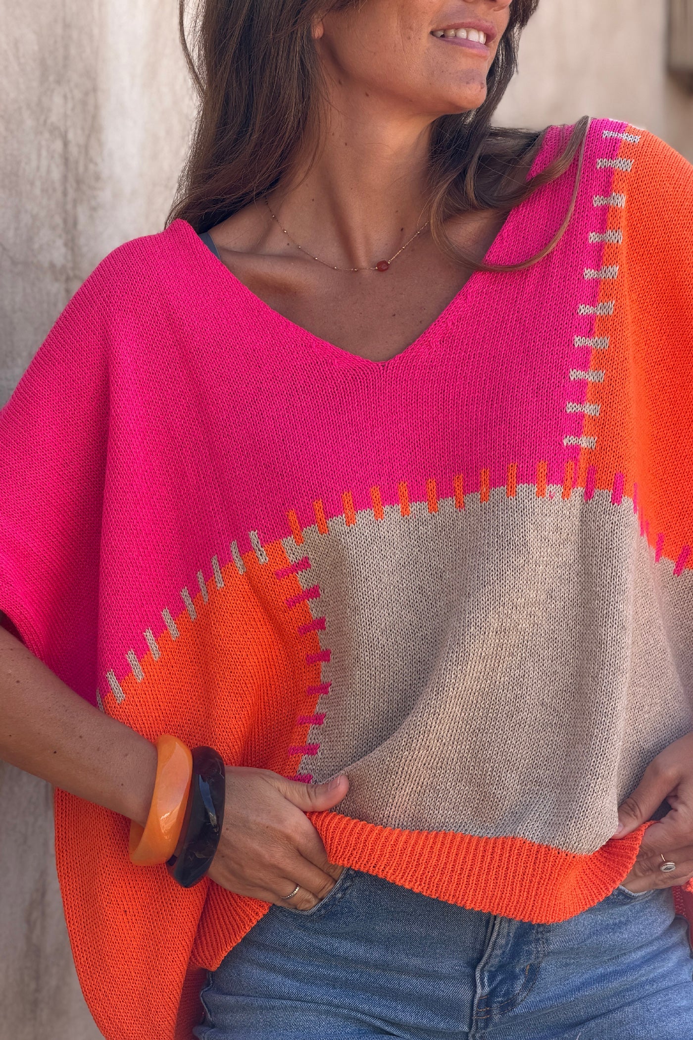 Lidia - Suéter holgado de punto de algodón con diseño de patchwork en naranja y fucsia